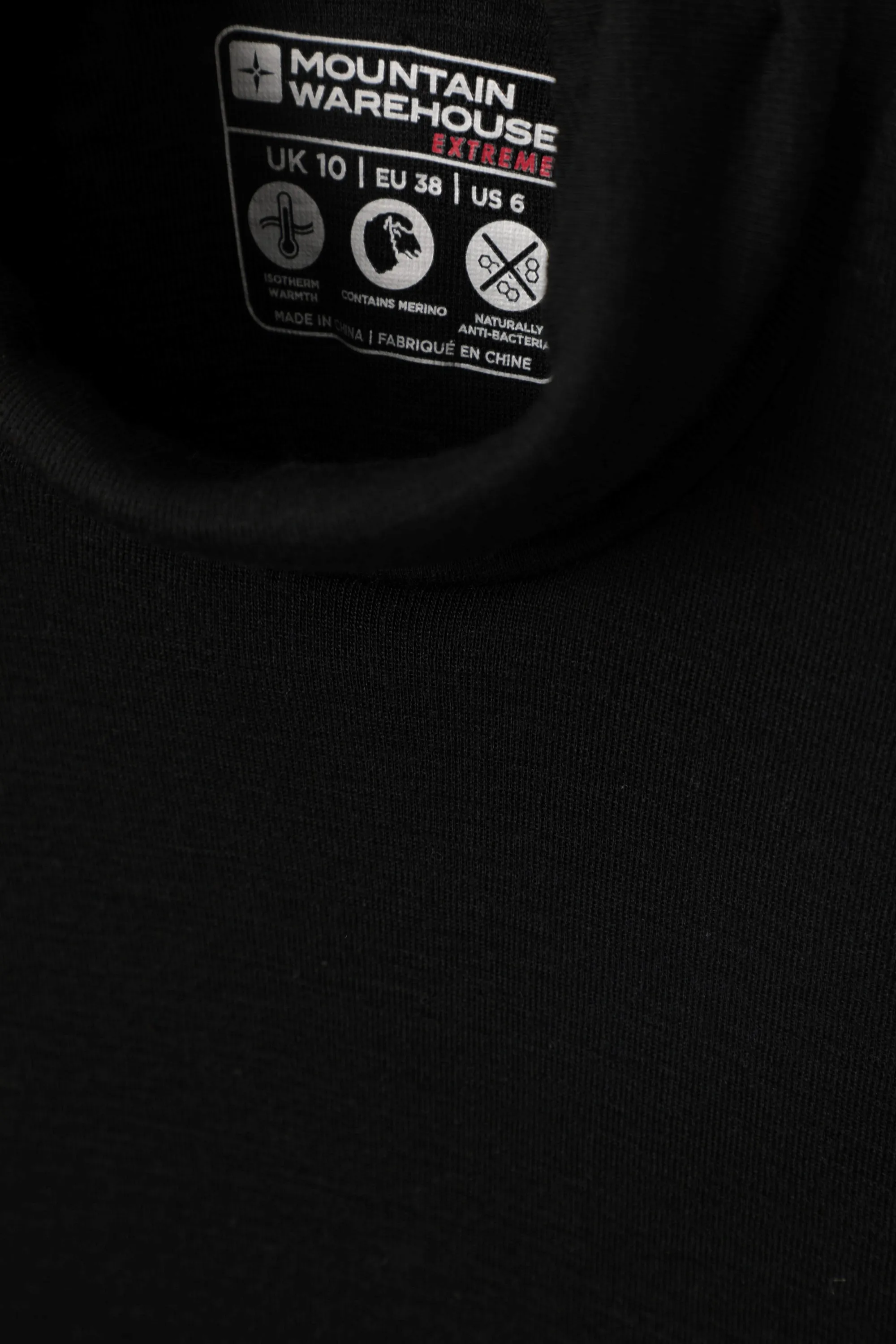 Top de merino con cuello vuelto para mujer